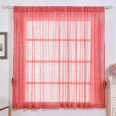 Sheer coral window curtain with a textured finish, elegantly draping.