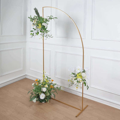 Gold arch stand with floral arrangements, perfect for events or decor.