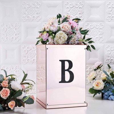Decorative floral arrangement in a stylish box with a letter "B".