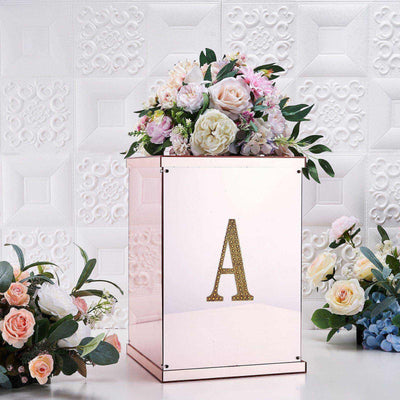 Elegant floral arrangement in a rose gold display box with a decorative letter "A".