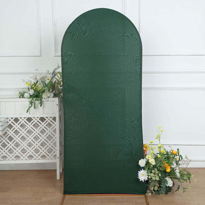 Green backdrop with floral arrangement, perfect for photography or events.