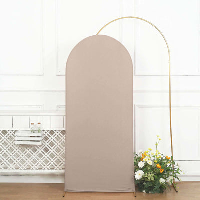 Beige fabric backdrop with arched top and gold stand, adorned with flowers.