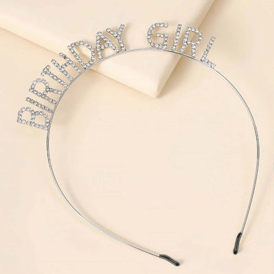 Rhinestone "Birthday Girl" headband in silver on a light background.