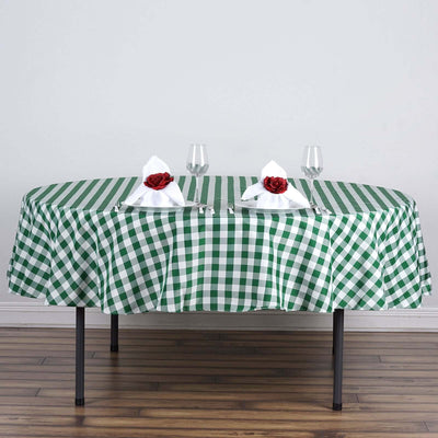 Green and white checkered tablecloth on an elegantly set dining table.