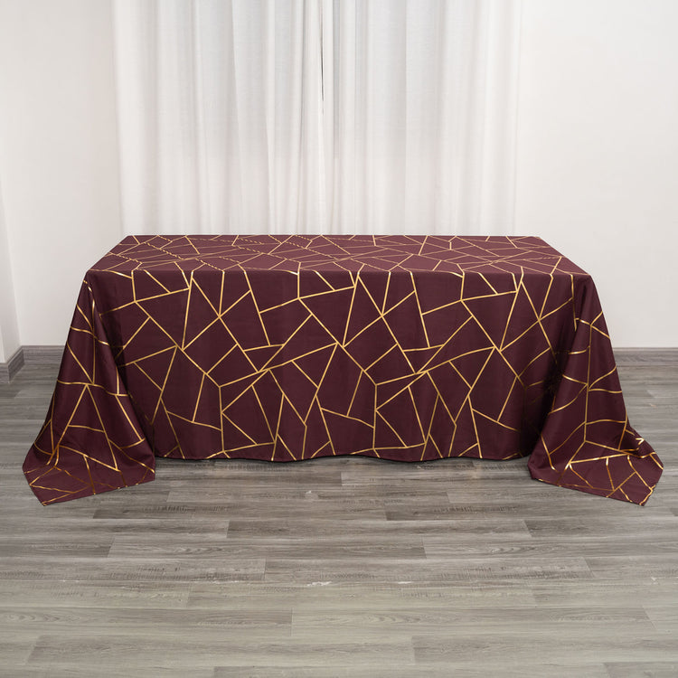 90 Inch x 132 Inch Burgundy Polyester Tablecloth With Gold Foil Geometric Pattern