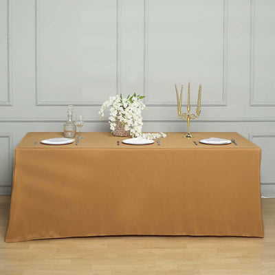 Elegant brown tablecloth on a dining table set with plates and decor.