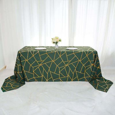 Green geometric tablecloth with yellow lines on a dining table.
