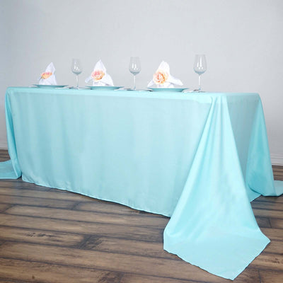 Light blue tablecloth set for an elegant dining experience.
