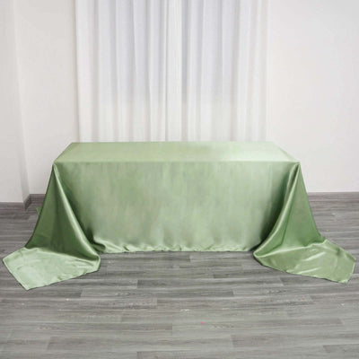 Green satin tablecloth draped elegantly over a table.