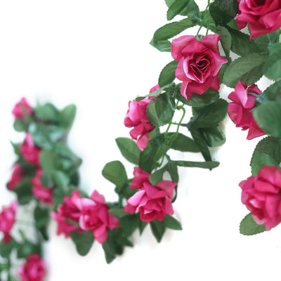 Artificial pink rose garland with green leaves