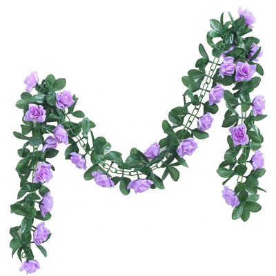 Purple rose garland with green leaves on a white background