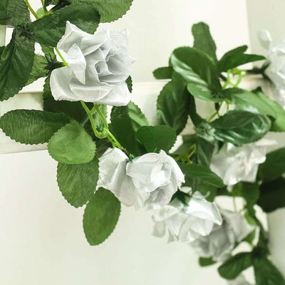 Artificial white rose garland with green leaves