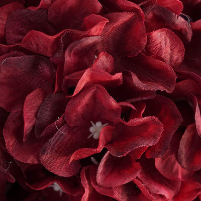Red fabric flower petals close-up detail shot.