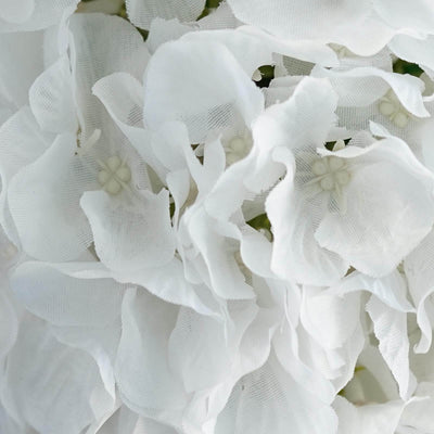 White fabric flowers close-up, showcasing delicate texture and detail.