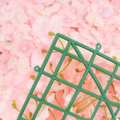 Green floral arrangement grid against pink flower backdrop.