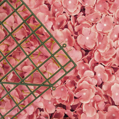 Green grid on pink flower petals background.