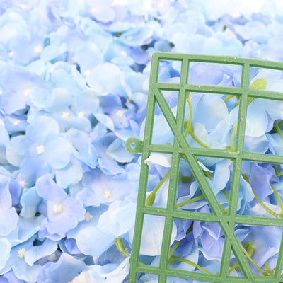 Green flower arranging grid on blue artificial flowers.