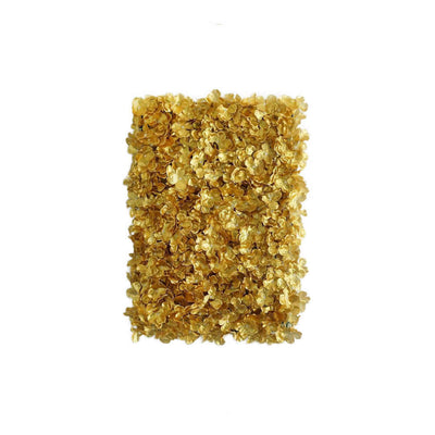Dried golden flower petals on a white background