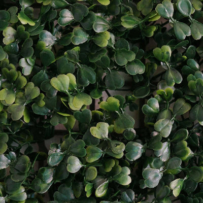 Artificial green leaves for decoration or craft projects.