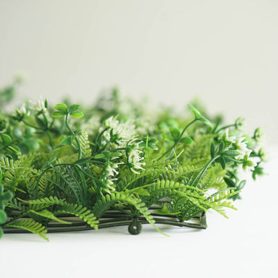 Artificial green floral arrangement with white flowers