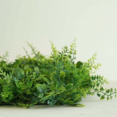 Artificial green foliage arrangement