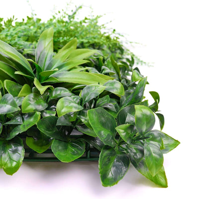 Artificial green plant arrangement on a white background