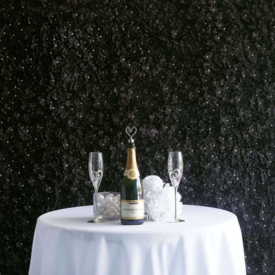 Champagne bottle and glasses on a table with decorative flowers