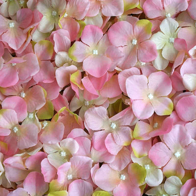 Pink and white artificial flower petals layered together.