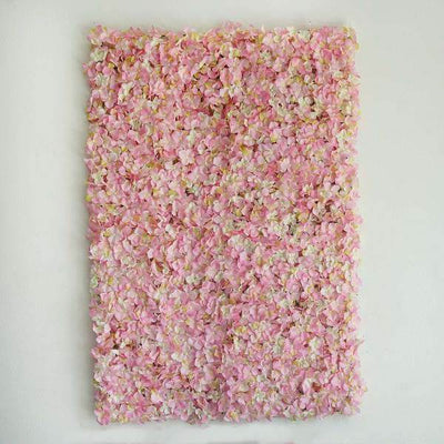Pink flower wall art piece with a textured design.