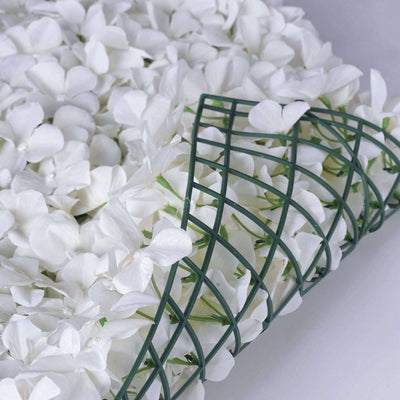 White artificial flower mat with green grid backing.
