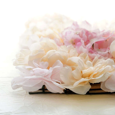 Soft pink and cream artificial flowers arranged beautifully.