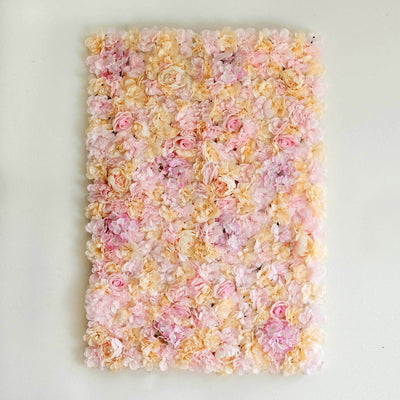Floral wall art with pink and cream roses on a light background.