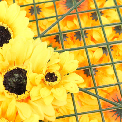 Yellow artificial sunflowers arranged on a green grid background.
