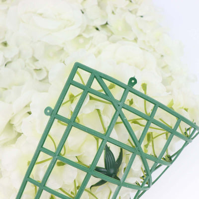 Green floral foam grid surrounded by white artificial flowers