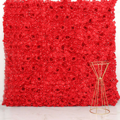 Red floral backdrop with gold stand for events and photo shoots.