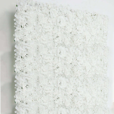 White floral wall panel made of artificial roses for event decor.