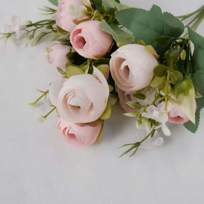 Pink artificial roses bouquet with greenery