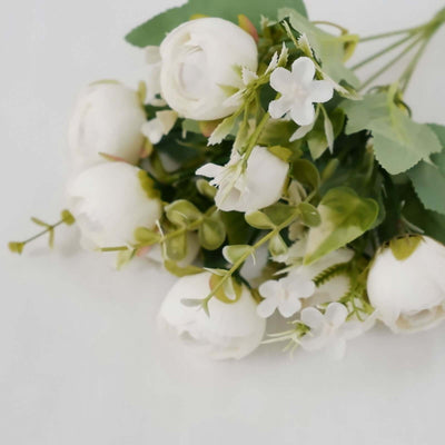 Artificial white flower bouquet with green leaves