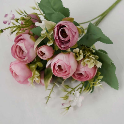 Pink artificial flower bouquet with greenery
