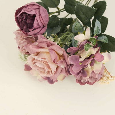 Bunch of artificial flowers in shades of pink and purple