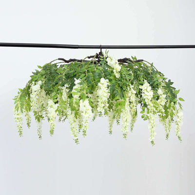 Hanging artificial wisteria flower arrangement with green leaves