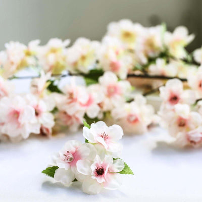 Delicate pink cherry blossom flowers arranged artistically.