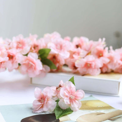 Pink cherry blossom flowers on a magazine cover.
