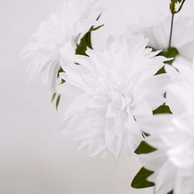 White artificial flowers in a minimalist arrangement.