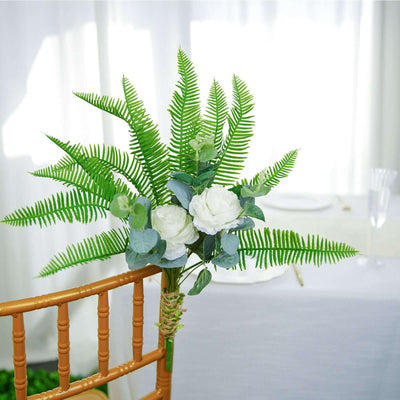 Artificial flower arrangement with greenery for event decor.