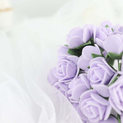 Lavender artificial rose bouquet on soft white fabric