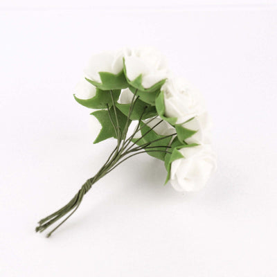 White flower bouquet with green leaves on a white background