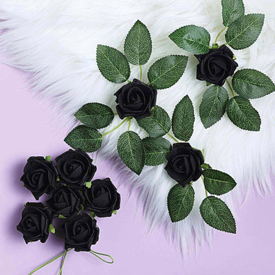 Black rose garland with green leaves on a light purple background.