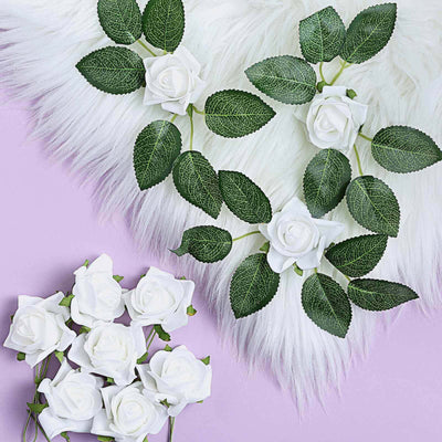Artificial white rose garlands with green leaves on a pastel purple background.
