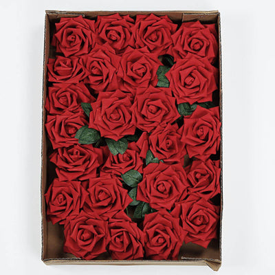 Red artificial roses in a cardboard box arrangement.
